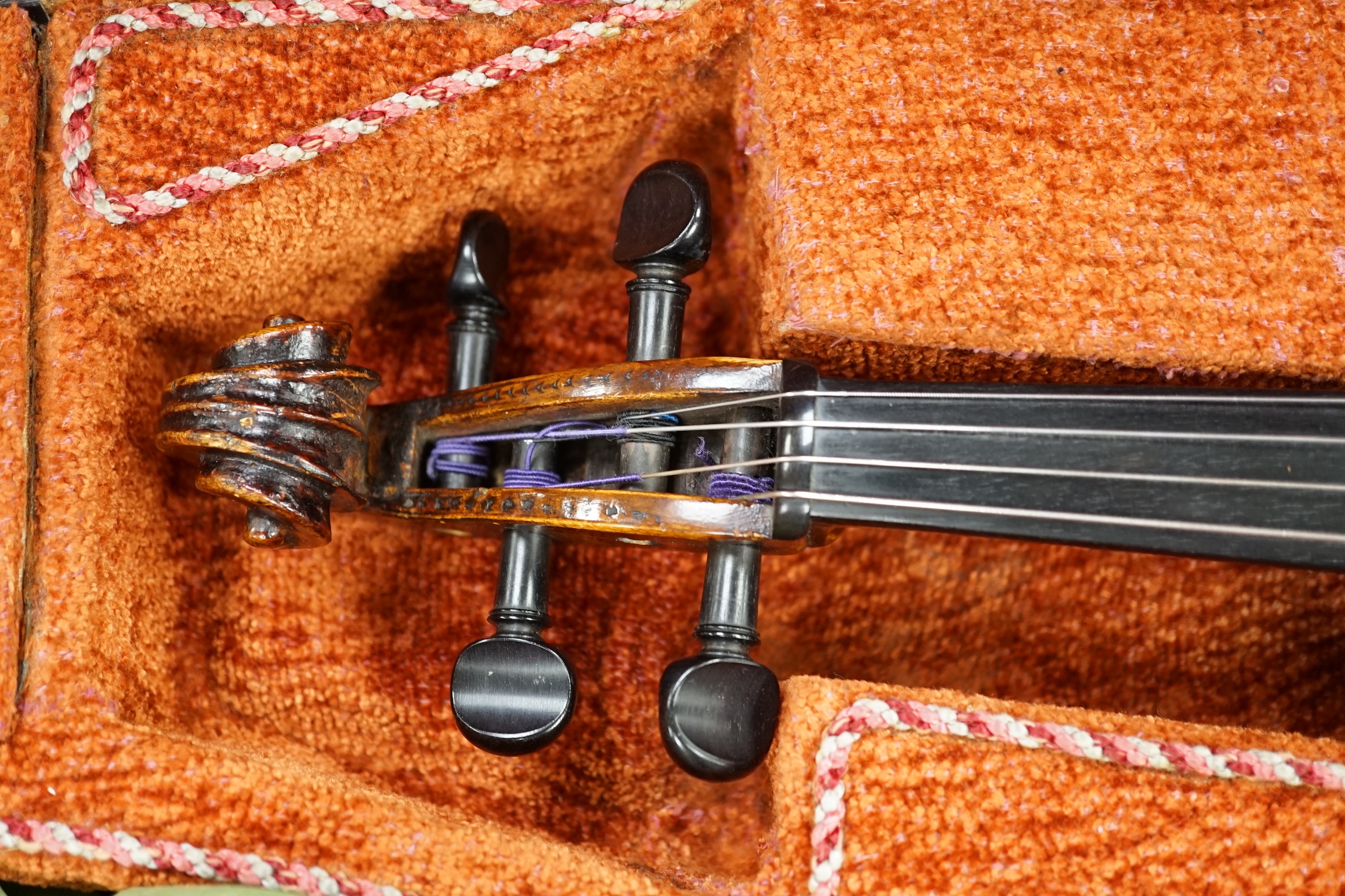 A cased 19th century German viola, length of body 39cm, in a good double case incorporating space for violin, without bow